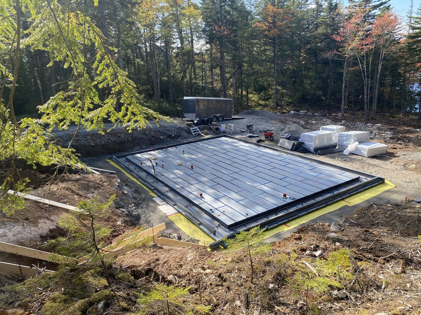 Floating slab with vapour barrier and in-floor grid, formed and ready for pour